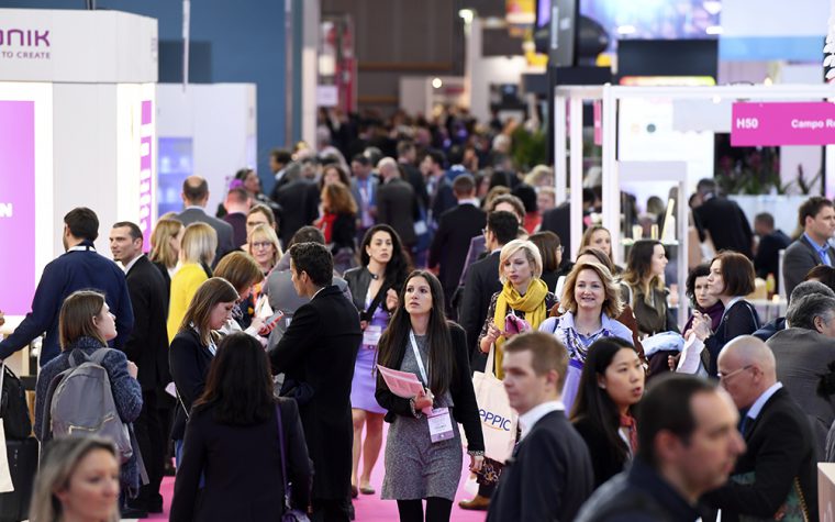 Exhibitors and visitors mingle at the show floor of in-cosmetics Global