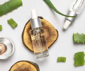 cosmetics in natural setting with aloe vera